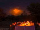 Lightning strikes in the background just before this bush braai had to be packed up to avoid a storm!