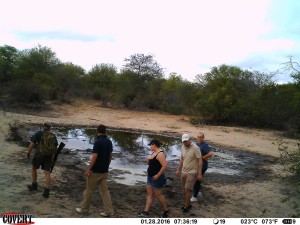 Africa on Foot walking safari group circling Sneaky Pan and checking for tracks in the mud