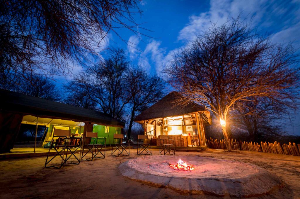 Tuskers main camp area with campfire, dining tent, and thatched bar-lounge Tuskers main camp area with campfire, dining tent, and thatched bar-lounge